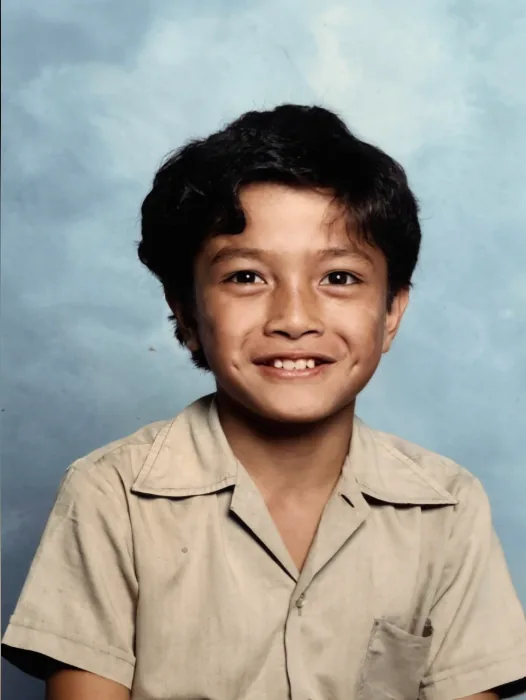 Michael Le at Kingsgrove Primary School in Sydney, age 9. By eight he was working at his father's takeaway shop, by ten running a newspaper round before school.